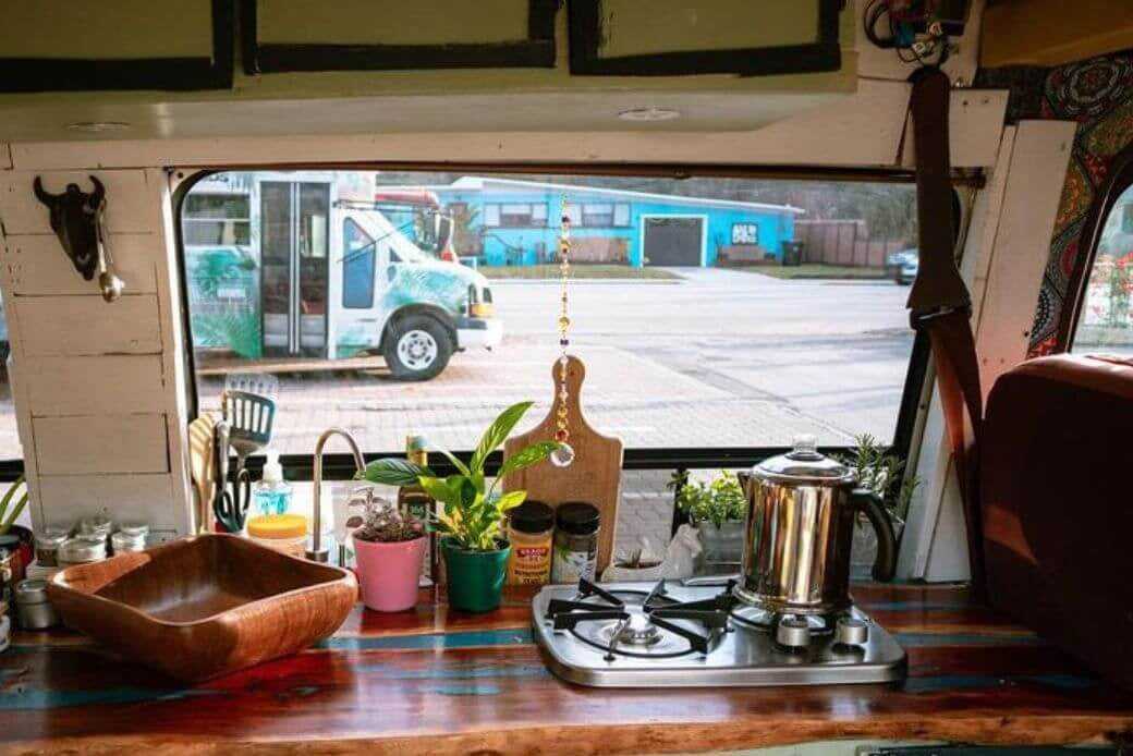 Cooking dinner or lunch in campervan, motorhome or RV. Preparing