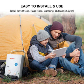 A man and a child sitting in a tent next to a Camplux portable water heater  AY132 for camping.