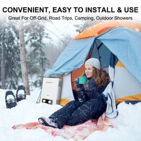 A woman sits in a tent, surrounded by snow, holding a cup of hot water, Camplux tankless water heater next to her.