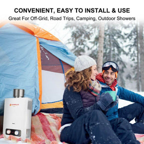 A couple in a snow-covered tent with a Camplux water heater nearby.