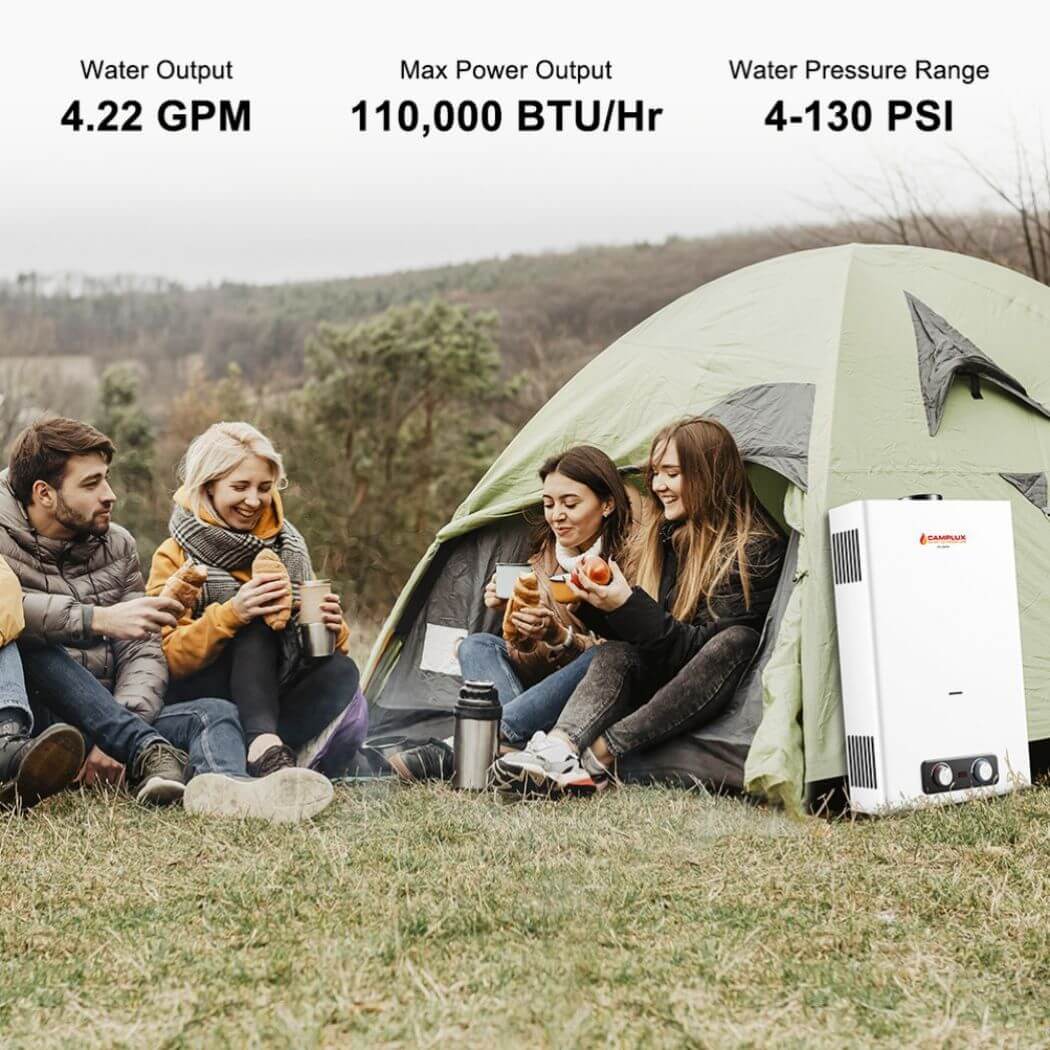 A group of people eating outside a tent with a Camplux BD422 water heater beside.